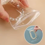 ⁦٥٠ كيسًا شفافًا من مادة PVC لتخزين المجوهرات، مزودة بسحاب، لحفظ الأقراط والقلائد، وحقائب عرض المجوهرات للسفر.⁩ - الصورة ⁦3⁩